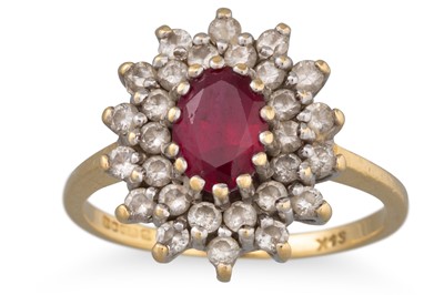 Lot 219 - A RUBY AND DIAMOND CLUSTER RING, the oval ruby...