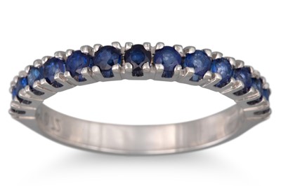 Lot 128 - A SAPPHIRE HALF ETERNITY RING, mounted in 18ct...