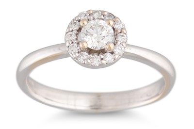 Lot 132 - A DIAMOND HALO CLUSTER RING, the brilliant cut...