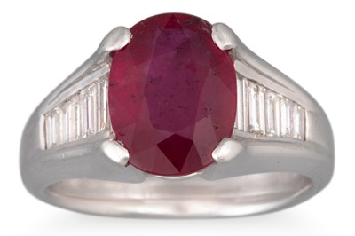 Lot 249 - A RUBY AND DIAMOND RING, the oval ruby to...