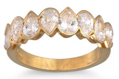 Lot 253 - A DIAMOND RING, set with pearl shaped diamonds,...