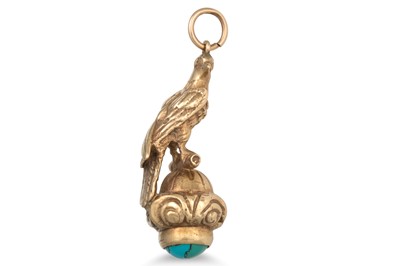 Lot 16 - A TURQUOISE SET PENDANT, in the form of a bird...