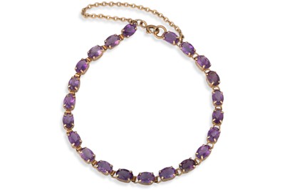 Lot 25 - AN AMETHYST SET BRACELET, mounted in gold, 5.1 g.