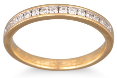 Lot 137 - A DIAMOND HALF ETERNITY RING, the brilliant...