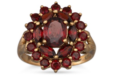 Lot 68 - A GARNET CLUSTER RING, mounted in 9ct yellow...