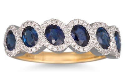 Lot 141 - A DIAMOND AND SAPPHIRE RING, the six oval cut...