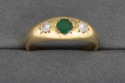 Lot 7 - AN EMERALD AND DIAMOND RING, mounted in 18ct...