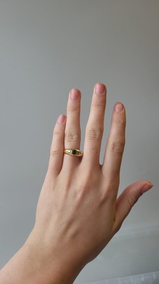 Lot 51 - AN EMERALD AND DIAMOND RING, mounted in 18ct...