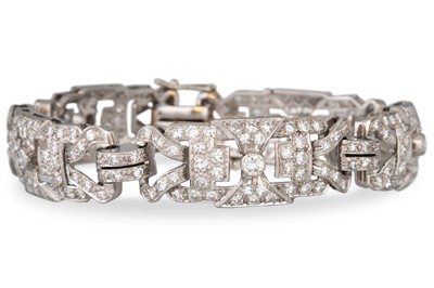 Lot 271 - A DIAMOND COCKTAIL BRACELET, shaped open work...