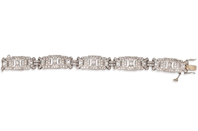 Lot 271 - A DIAMOND COCKTAIL BRACELET, shaped open work...