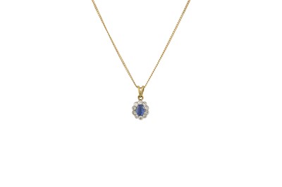 Lot 219 - A SAPPHIRE AND DIAMOND CLUSTER OVAL PENDANT,...