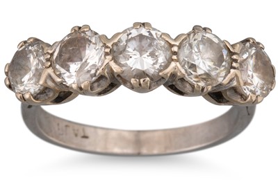 Lot 91 - A FIVE STONE DIAMOND RING, mounted in platinum....