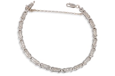 Lot 242 - A DIAMOND SET BRACELET, mounted in 10ct white...