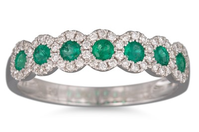 Lot 103 - AN EMERALD AND DIAMOND RING, the round...