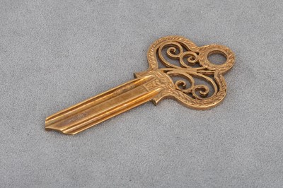 Lot 76 - A MODERN 9CT GOLD KEY BLANK, boxed, unused,...