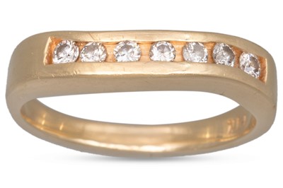 Lot 173 - A DIAMOND HALF ETERNITY RING, shaped form, the...