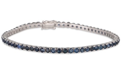 A SAPPHIRE LINE BRACELET, the circular stones...