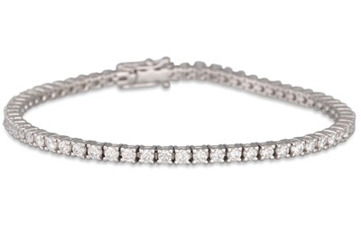 A DIAMOND LINE BRACELET, the brilliant cut...