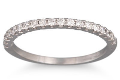 A DIAMOND HALF ETERNITY RING, the brilliant...