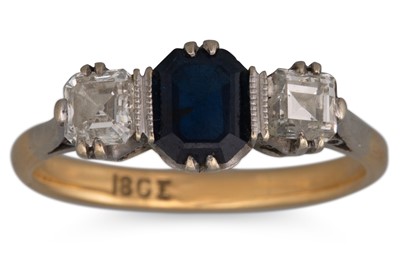 Lot 214 - A SAPPHIRE AND DIAMOND THREE STONE RING, the...