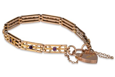 Lot 63 - A GATE LINK BRACELET, set with amethyst and...