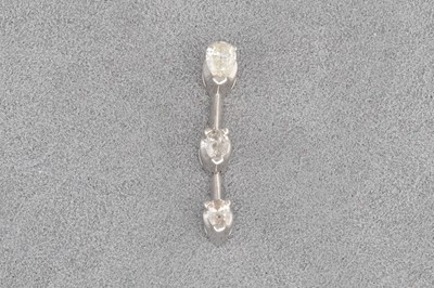 Lot 55 - A DIAMOND PENDANT, set with three pear shaped...