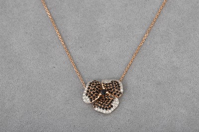 Lot 58 - A DIAMOND AND BLACK GEM-SET PAVÉ PENDANT,...