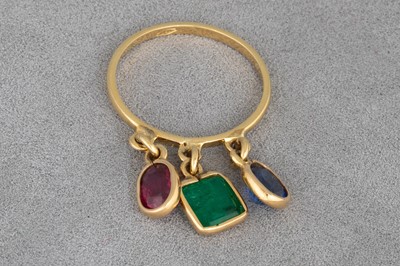 Lot 42 - AN EMERALD, RUBY AND SAPPHIRE RING, the three...