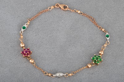 Lot 45 - A RUBY, EMERALD AND DIAMOND CLUSTER BRACELET,...