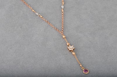 Lot 108 - A DIAMOND AND RUBY CLUSTER NECKLACE, of drop...