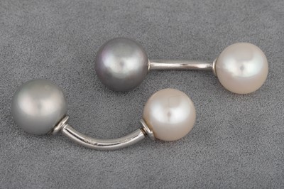 Lot 109 - A PAIR OF PEARL CUFF LINKS, of silver & grey...