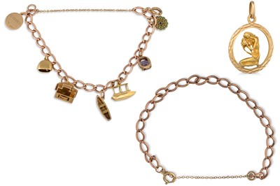 Lot 14 - A GOLD BRACELET, suspending charms, together...