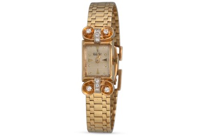 Lot 389 - A VINTAGE 14CT GOLD LADY'S WRISTWATCH, "Chalet"...