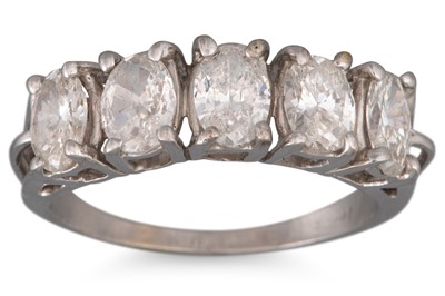 Lot 131 - A DIAMOND FIVE STONE RING, the oval diamonds...