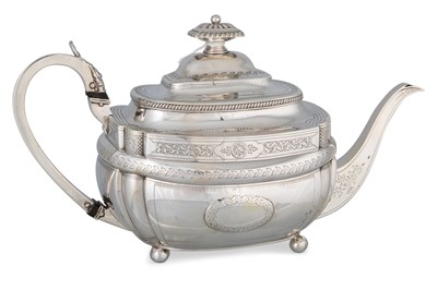 Lot 199 - A GEORGE III SILVER TEA POT, with chaised and...