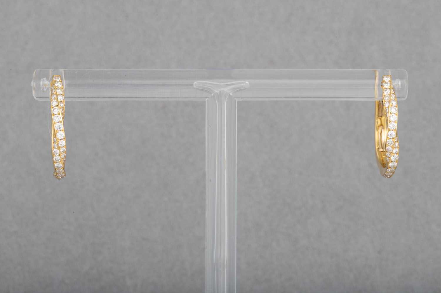 Lot 13 - A PAIR OF DIAMOND SET HOOPS, in 18ct yellow...