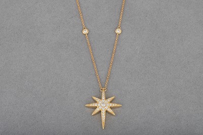 Lot 15 - A DIAMOND SET PENDANT, modelled as a star, in...