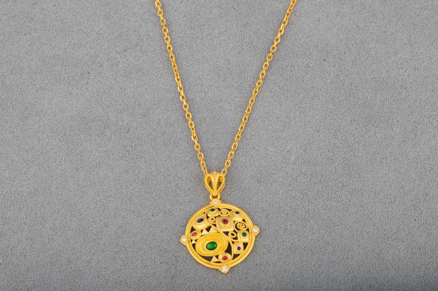 Lot 16 - A 24CT GOLD GEM SET PENDANT, of Eastern style