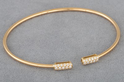 Lot 21 - A DIAMOND SET OPEN BANGLE, pavé set in 18ct...