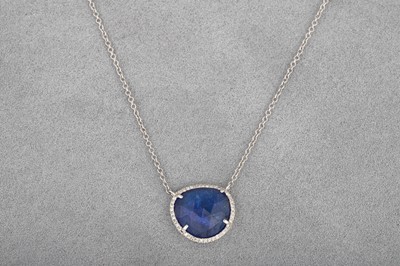 Lot 24 - A SAPPHIRE AND DIAMOND PENDANT, faceted rose...