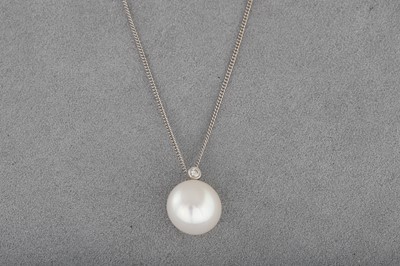 Lot 52 - A CULTURED PEARL AND DIAMOND PENDANT, mounted...