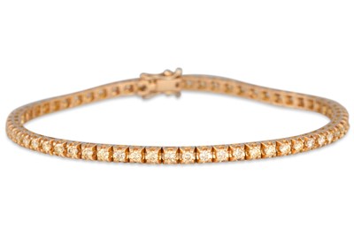 Lot 83 - A DIAMOND LINE BRACELET, the yellow diamonds...