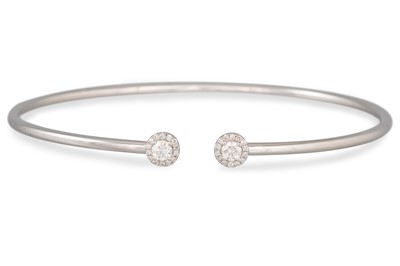 Lot 90 - A DIAMOND SET OPEN BANGLE, in 18ct yellow gold,...