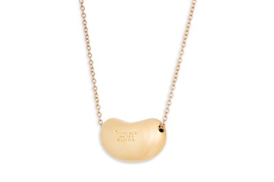 Lot 169 - AN 18CT GOLD TIFFANY 'BEAN' PENDANT, by Elsa...