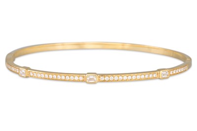 Lot 170 - A DIAMOND SET BANGLE, mounted in 18ct yellow...