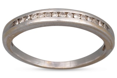 Lot 209 - A DIAMOND HALF HOOP ETERNITY RING, the channel...