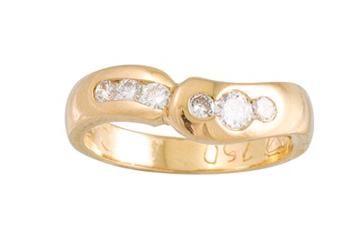 Lot 104 - A CHANNEL SET DIAMOND RING, in 18ct yellow...