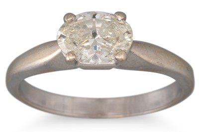 Lot 268 - A DIAMOND SOLITAIRE RING, the oval diamond set...