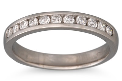 Lot 317 - A DIAMOND HALF ETERNITY RING, the channel set...