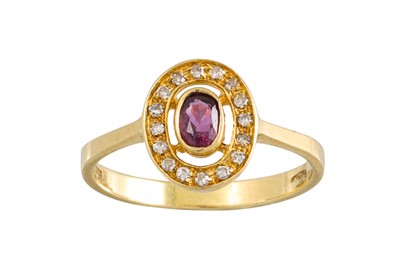 Lot 107 - A RUBY AND DIAMOND CLUSTER RING, of oval form,...
